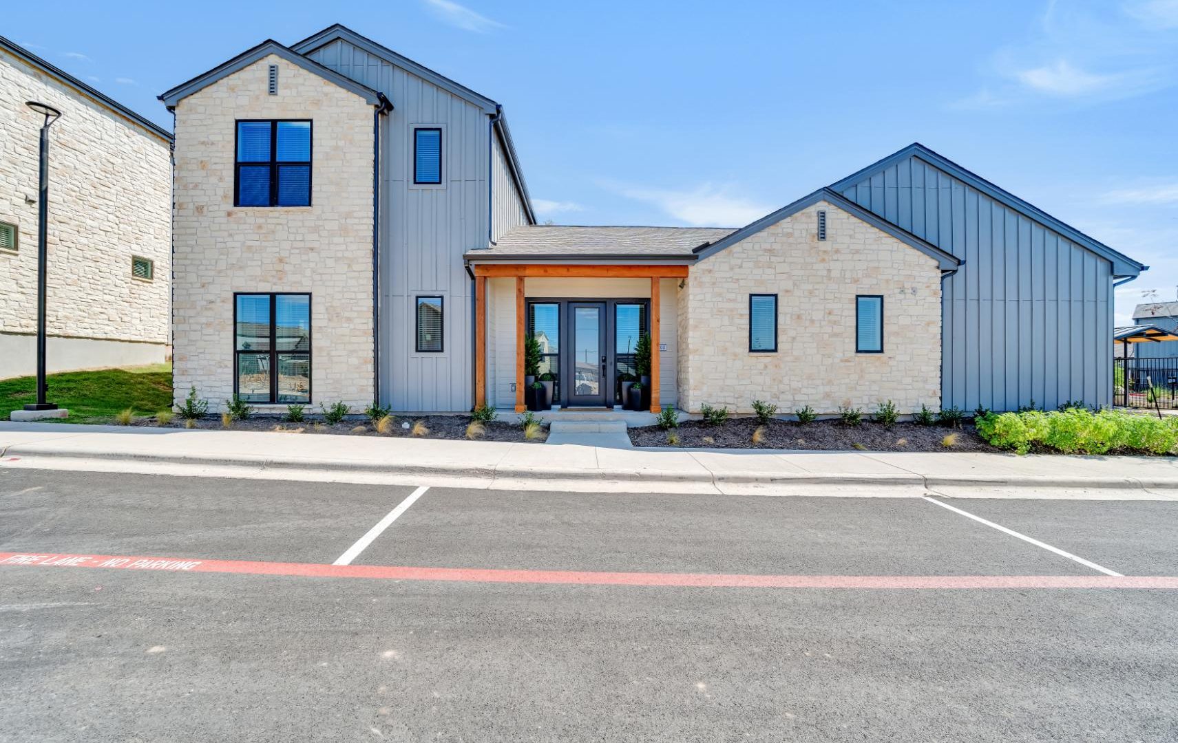 the exterior of a new home in a residential neighborhood at The parcHAUS at Mustang Drive